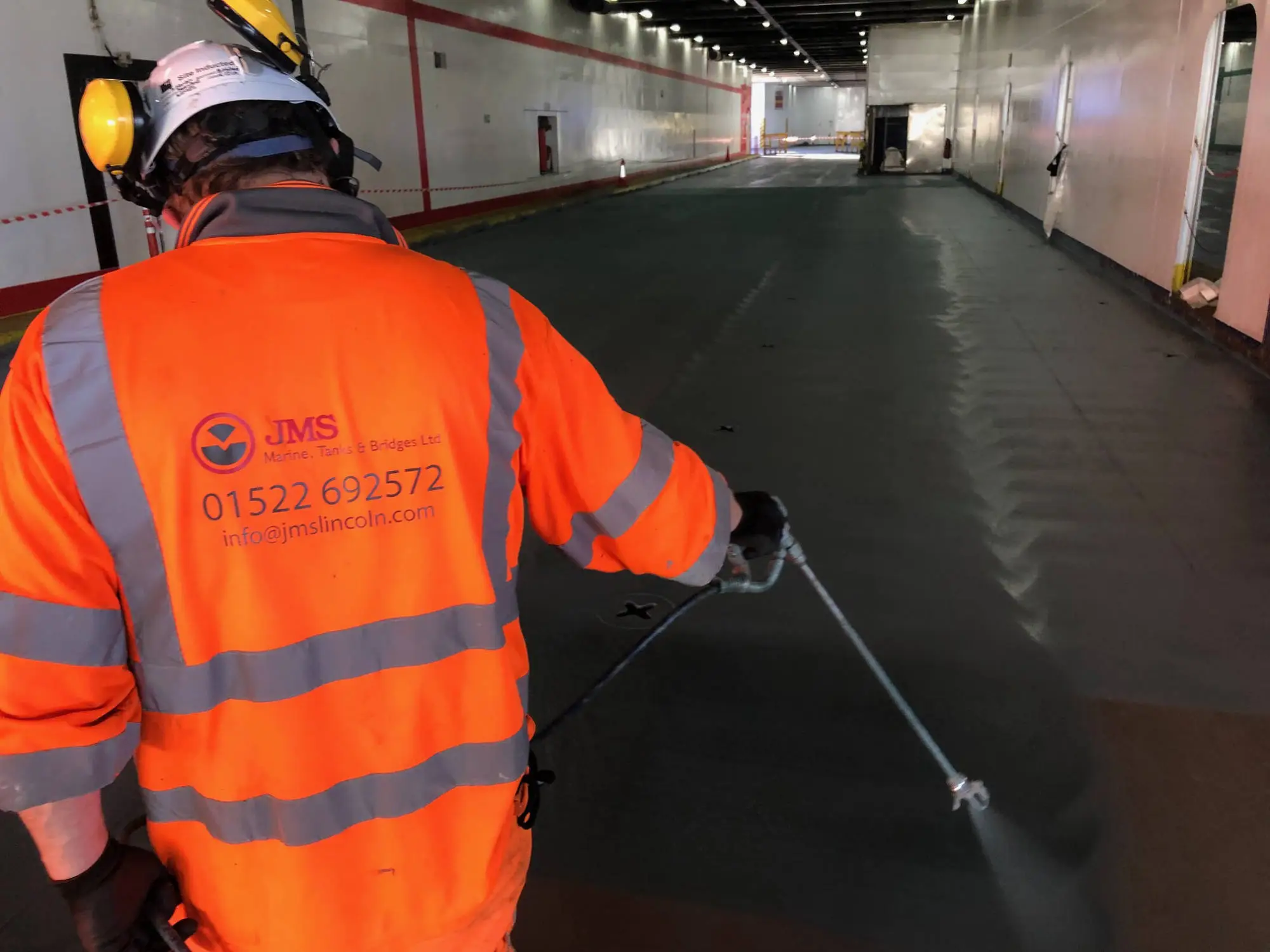 person-painting-ship-deck